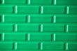 Wall of metallic bricks