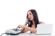 Secretary girl with an old phone and laptop