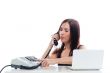 Secretary girl with an old phone and laptop