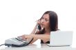 Secretary girl with an old phone and laptop