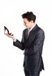 Young businessman with women's shoes