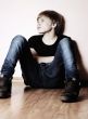 The teenager near a wall