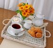 croissants with tea and milk on a tray