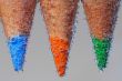 three colored pencils with bubble