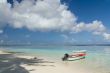 Fishing boat parked by deserted beach 