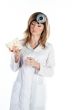 Female doctor with a human skull in his hands