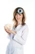 Female doctor with a human skull in his hands