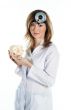 Female doctor with a human skull in his hands