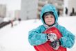 Boy with sleds on the hill