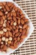 Roasted almonds and hazelnuts on a plate
