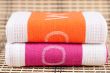 Two kitchen towels with the letters