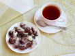 Tea with sweets in the shape of seashells 