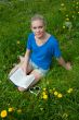 A girl student with a book in the park