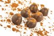 Chocolates sprinkled with cocoa, isolated on a white background 