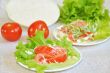 Tomatoes with mayonnaise on lettuce leaf