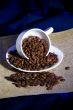 The inverted cup with coffee beans