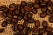 Coffee grains background on burlap