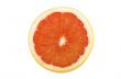 Ripe sliced of red grapefruit isolated on white background
