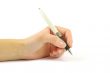 Closeup of a hand writing, on isolated on white background.