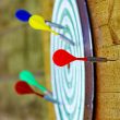  Colorful darts on dartboard