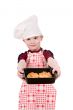 boy in chef`s hat with baking
