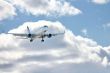 Modern airplane in the sky near airport. 