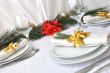    Coordinated decorative napkin on a plate with cutlery