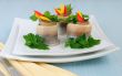 Rolls of herring with pickled cucumber and pepper