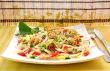 Scrambled eggs with green onions, fresh vegetables and sesame se