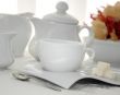 A cup of tea with sugar cubes