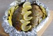 Baked herring in spices and herbs in foil