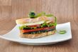 Sandwich with eggplant, tomatoes, peppers and cheese