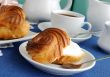 Eclairs with a cup of coffee
