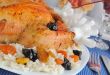 A fragment of grilled chicken with rice and dried fruit