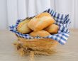 Fresh bread in a basket with a napkin shelter