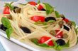 Spaghetti with tomato, capers and basil with olives