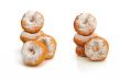 Fried donuts in powdered sugar on a white background