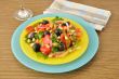 Salad of roasted peppers with tomato, peanuts and olives
