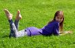 girl lying on grass