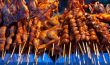 grilled skewers of meat and wings
