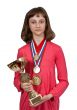 Girl with gold medals and a cup