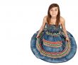 girl sitting on the floor in the denim dress