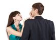 beautiful girl pulls the nose businessman