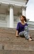 beautiful girl sitting on the marble steps