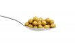 Spoon with green peas