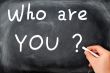 Who are you question written on a blackboard