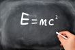 Relativity formula written on a  Blackboard background