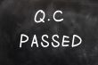 QC passed written on a chalkboard 