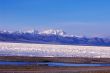 Landscape of snow-capped mountains and lake