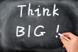 Think big written on a blackboard